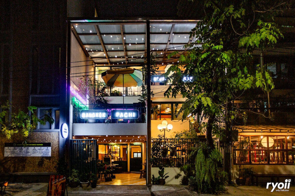 Pachi Bangkok storefront at night
